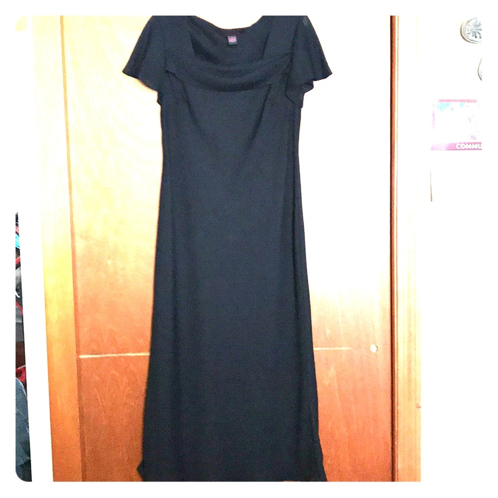 Tea length black dress.
